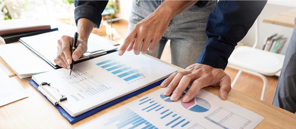 Featured image of a team studying analytics reports on a desk