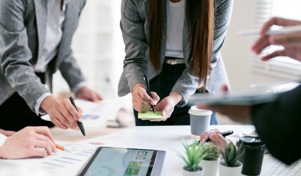 Business team reviewing revenue and sales performance data during a strategy planning meeting